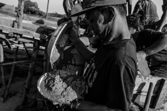 A teenager washes a collection of sand to get tin ore at an illegal mine in Pangkalpinang City, Bangka Belitung Province, Indonesia on March 13, 2020. Children often help their parents look for the tin to meet their family's economic needs and their own needs.-Seorang remaja mengumpulkan pasir untuk dicuci agar mendapatkan bijih timah di area tambang timah inkonvesional ilegal di Kota Pangkalpinang, Provinsi Bangka Belitung, Indonesia pada Maret 13, 2020. Anak-Anak membantu orang tuanya mencari timah untuk kebutuhan ekonomi dan untuk kebutuhan mereka sendiri.